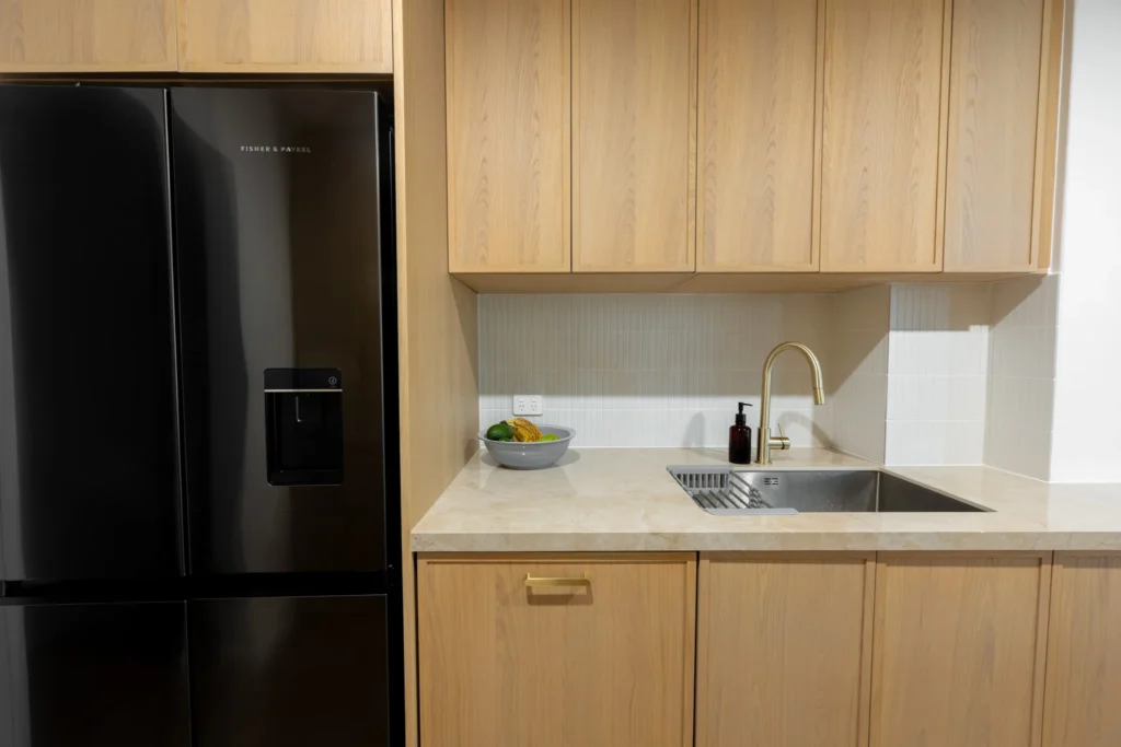 Sink and benchtop within the finished cabinetry.